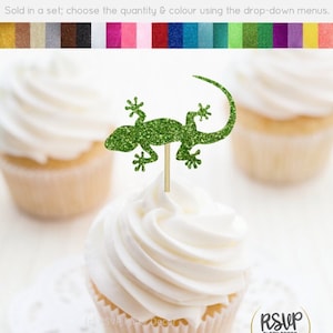 May include: Green glitter gecko cupcake topper. The topper is made of glitter cardstock and is perfect for adding a fun touch to your cupcakes. Sold in a set, choose the quantity and color using the drop-down menus.