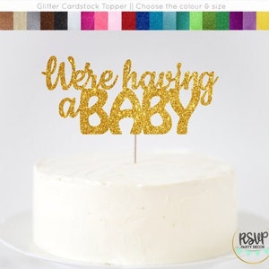Estamos teniendo un adorno de pastel de bebé, adorno de pastel de anuncio de embarazo, signo de embarazo, cartel de anuncio de bebé, decoraciones de ducha de bebé