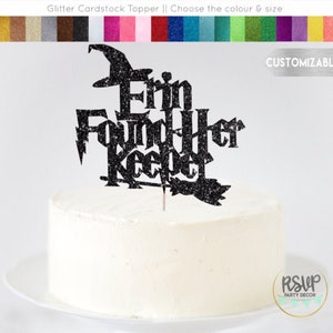 May include: Black glitter cardstock cake topper with the text "Erin Found Her Keeper" and a witch's hat and broom. The topper is customizable.