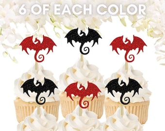 May include: Six cupcakes decorated with red and black glitter dragon cupcake toppers. The toppers are made of cardstock and have a glitter finish. The cupcakes are frosted with white frosting. The text "6 of each color" is visible in the image.