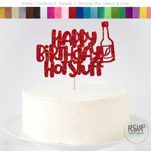 May include: Red glitter cake topper with the text "Happy Birthday Hot Stuff" and a bottle of hot sauce.