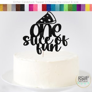 May include: A black glitter cardstock cake topper with a pizza slice design and the words "one slice of fun." The topper is placed on top of a white frosted cake. The image also includes the text "Glitter Cardstock Topper || Choose the colour & size."