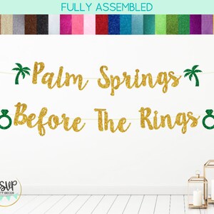 May include: Gold glitter banner with the text "Palm Springs Before The Rings" with green palm trees and ring icons.