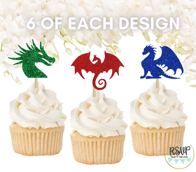 May include: Six cupcake toppers featuring glitter dragons in green, red, and blue. The toppers are on top of cupcakes with white frosting. The text "6 OF EACH DESIGN" is at the top of the image.