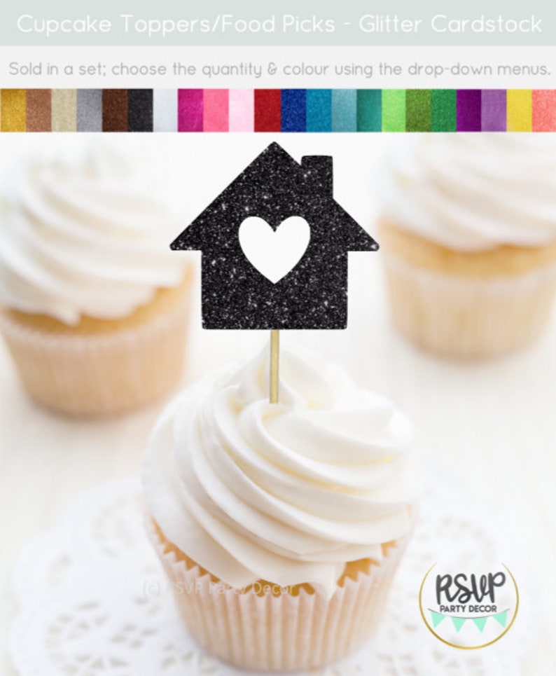 May include: Black glitter cupcake topper shaped like a house with a white heart cutout. The topper is on a cupcake with white frosting. The text "RSUP PARTY DECOR" is visible in the lower right corner of the image.