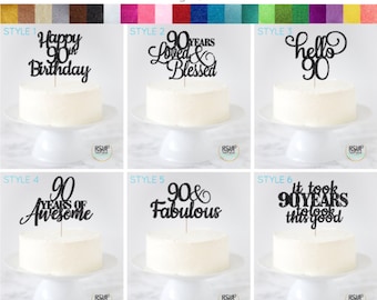 May include: Six different cake topper designs for a 90th birthday. The toppers are made of black glitter cardstock and feature various phrases such as "Happy 90th Birthday", "90 Years Loved & Blessed", "Hello 90", "90 Years of Awesome", "90 & Fabulous", and "It Took 90 Years to Look This Good".
