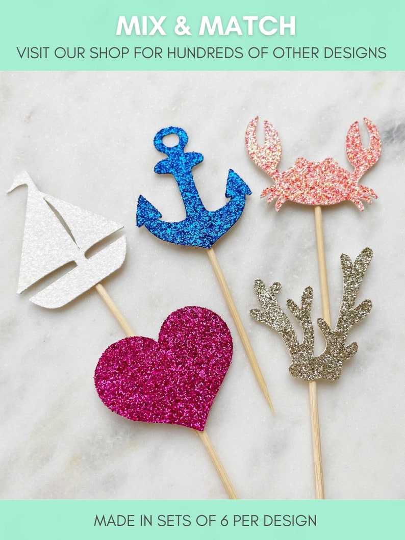 May include: Set of six glitter cupcake toppers featuring a sailboat, anchor, crab, heart, and reindeer antlers. The toppers are made in sets of six per design.  "Mix & Match" and "Visit our shop for hundreds of other designs" are written at the top of the image.