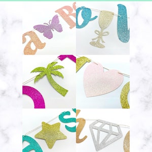 May include: A set of glitter banner shapes, including a butterfly, a wine glass, a palm tree, a heart, a star, and a diamond. The shapes are all different colors and are strung together with a white string.