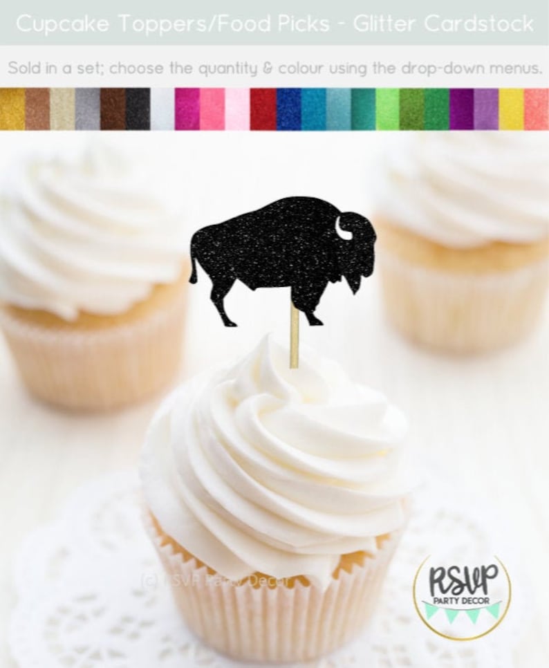 May include: Black glitter buffalo cupcake topper on a white cupcake with white frosting. The cupcake is on a white doily. The topper is on a wooden stick. The text "RSVP PARTY DECOR" is on a white circle with a green border.