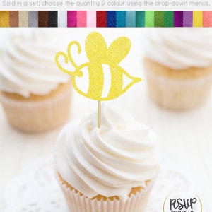 May include: Yellow glitter cardstock bee cupcake topper with black stripes. Sold in a set, choose the quantity and color using the drop-down menus. RSVP Party Decor.