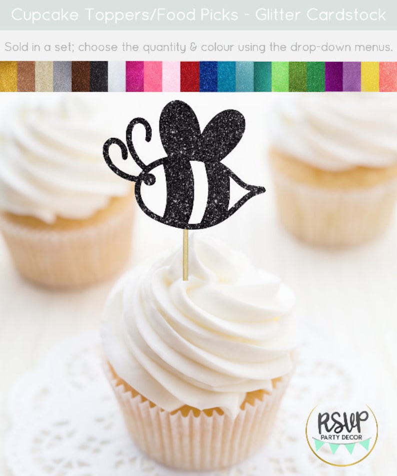 May include: Black glitter bee cupcake topper with white stripes. The bee is on a wooden stick and is ready to be placed on a cupcake. The cupcake topper is sold in a set and is available in a variety of colors.