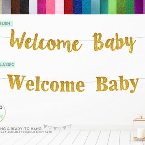 May include: Gold glitter banner with the text "Welcome Baby" in two different fonts. The banner is pre-strung and ready to hang.
