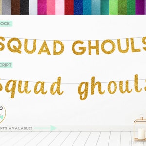 May include: A gold glitter banner featuring the text SQUAD GHOULS in two different styles: a block font and a script font. The banner is suspended on a thin string. A color palette of various glitter paper options is displayed at the top.