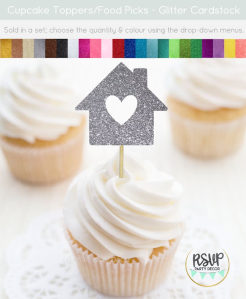 May include: Silver glitter cupcake topper shaped like a house with a heart cut out. The topper is on a cupcake with white frosting. The text "RSVP Party Decor" is visible in the bottom right corner of the image.
