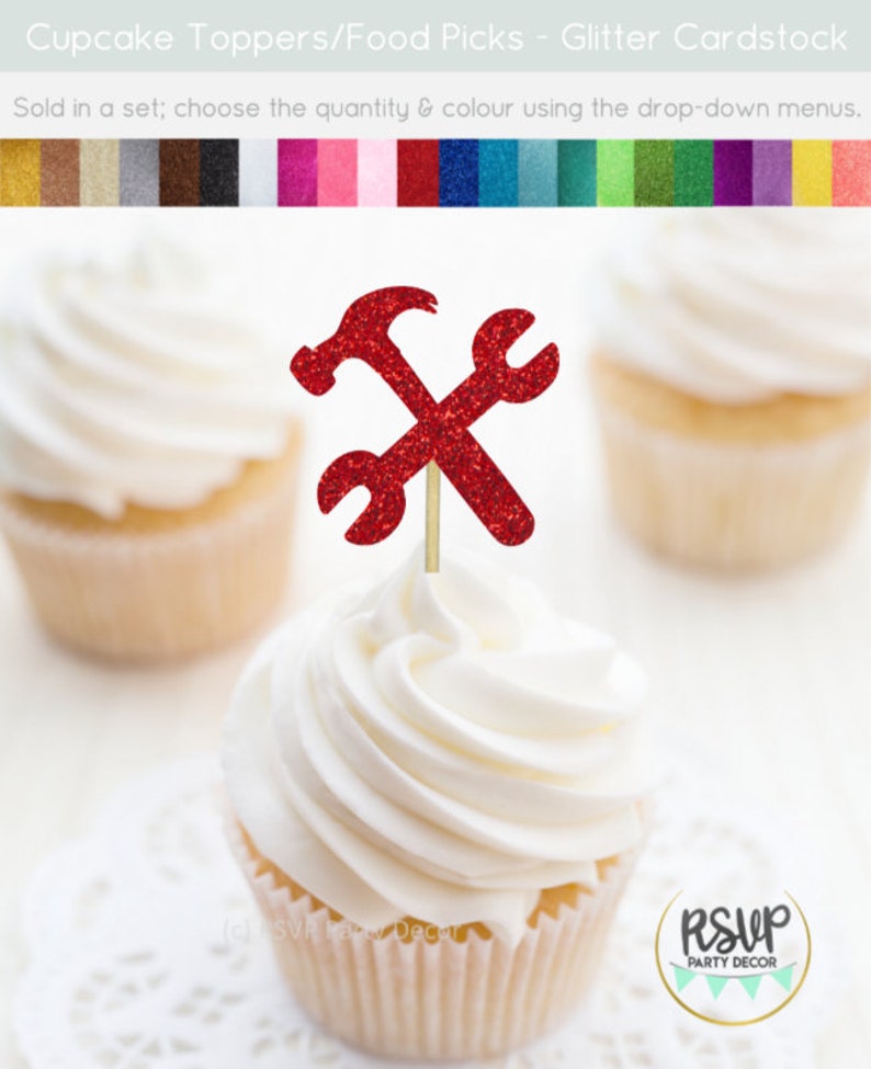 May include: Red glitter cupcake topper with a hammer and wrench design. The topper is on a white cupcake with white frosting. The cupcake is on a white doily. The text "RSVP Party Decor" is on a circle in the lower right corner of the image.
