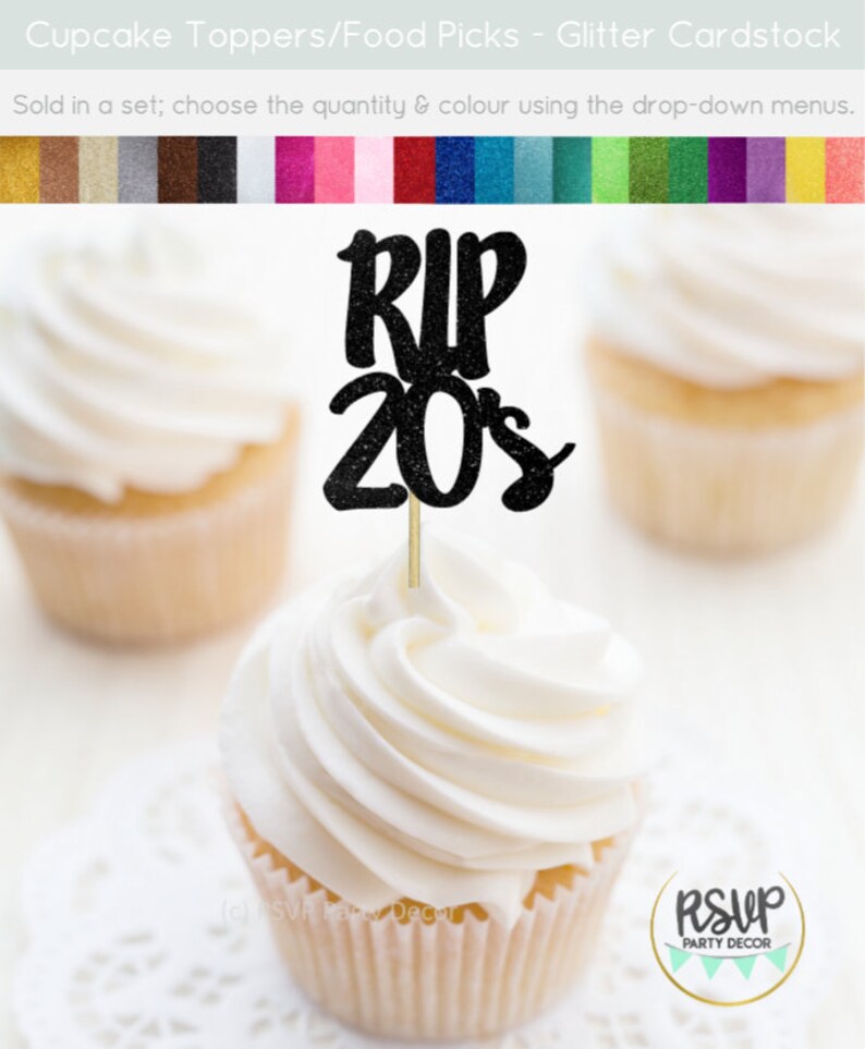 May include: Black glitter cupcake topper with the text "RIP 20s". The topper is on a cupcake with white frosting. The cupcake is on a white doily.