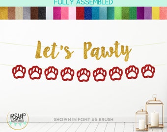 May include: Gold glitter "Let's Pawty" banner with red glitter paw prints. The banner is fully assembled and ready to hang. The banner is shown in font #5 brush.