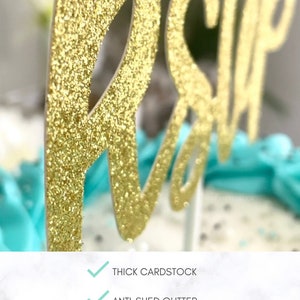 May include: Gold glitter "RSVP" cake topper made of thick cardstock. The topper is professionally cut and features anti-shed glitter. The letters are in a cursive font, perfect for a party or event.