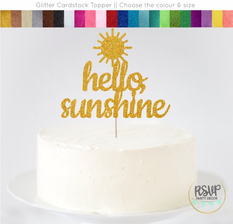 May include: Gold glitter cardstock cake topper with a sun and the words "hello sunshine".