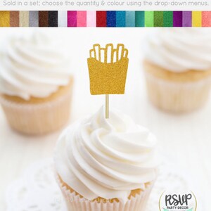 May include: Gold glitter cupcake topper shaped like a box of french fries. The topper is on a white cupcake with white frosting. The text "RSVP Party Decor" is visible in the image.