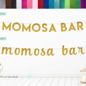 May include: Gold glitter banner with the words "MOMOSA BAR" in block letters and "momosa bar" in script letters. The banner is hanging on a white wall.