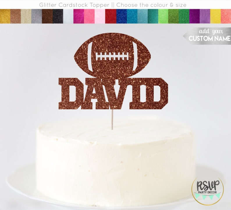 May include: Brown glitter cardstock cake topper featuring a football and the name "DAVID" in large letters. The topper is displayed on a white cake.