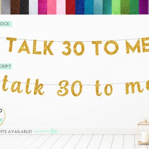 May include: Gold glitter banner with the text "TALK 30 TO ME" in block letters and "talk 30 to me" in script letters. The banner is hanging on a white wall. The text "MORE FONTS AVAILABLE!" is written below the banner.