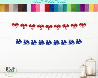 May include: Two glitter dragon banners, one red and one blue, hang against a white wall. The top banner features red dragons, and the bottom banner has blue dragons. The text "FULLY ASSEMBLED" is at the top.