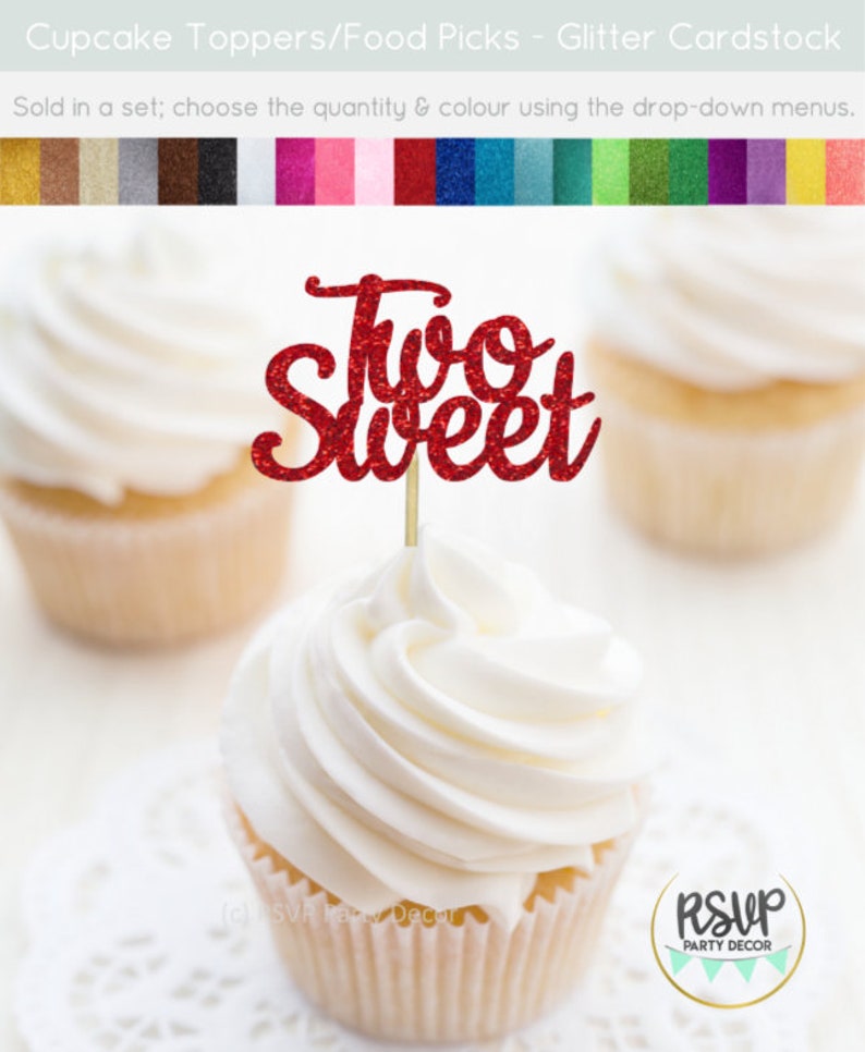 May include: Red glitter cupcake topper with the words "Two Sweet" on it. The topper is on a cupcake with white frosting.