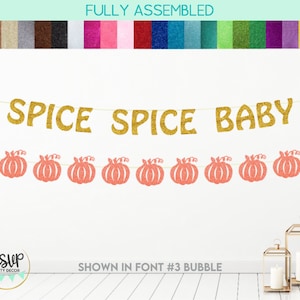 May include: A glittery gold banner with the text SPICE SPICE BABY suspended above a second banner featuring nine glittery orange pumpkin cutouts. The text is in a bubble font style. A colour swatch bar is displayed at the top of the image.