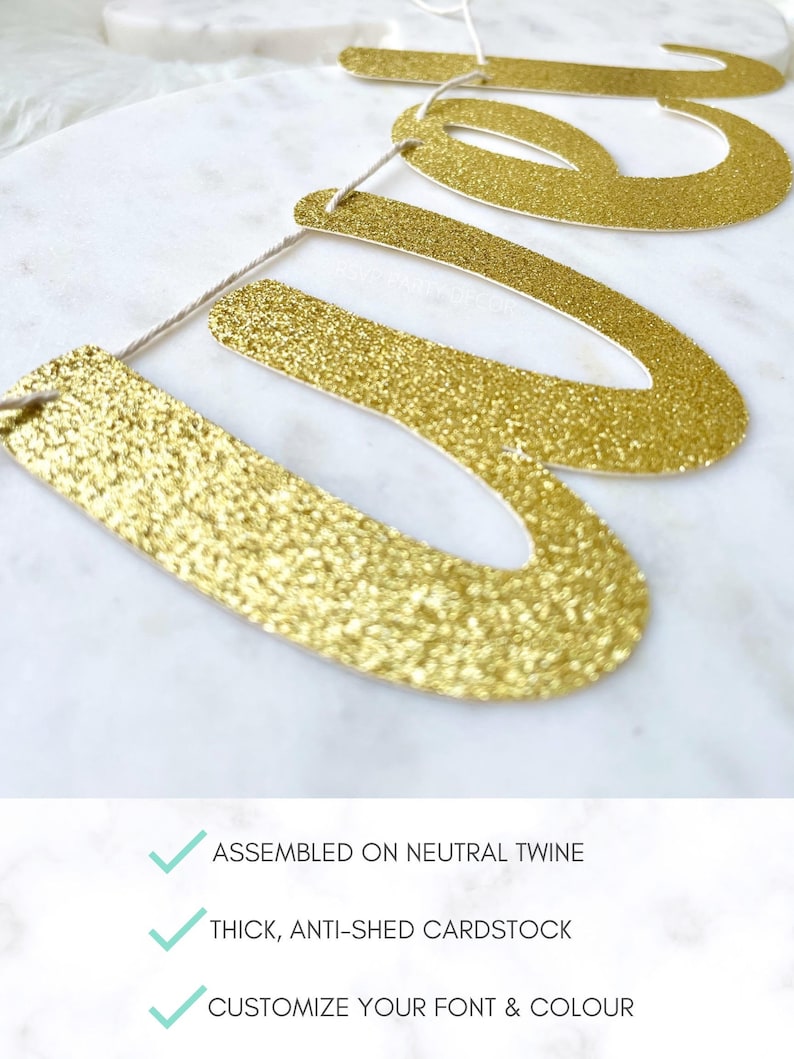 May include: Gold glitter banner with the word "We" on it. The banner is assembled on neutral twine and made of thick, anti-shed cardstock. The font and color can be customized.