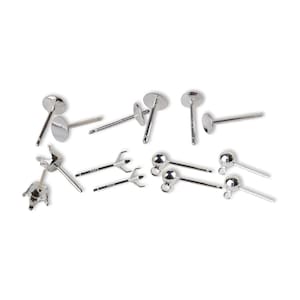 May include: An assortment of silver earring components, including flat-backed posts, ball studs with loops, and prong settings. The components are arranged on a white surface, suitable for jewellery making.