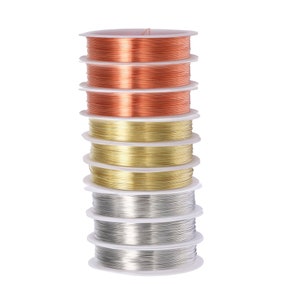 May include: A stack of spools of wire in different colors, including copper, gold, and silver. The spools are arranged in a vertical stack, with the copper spools at the top and the silver spools at the bottom.