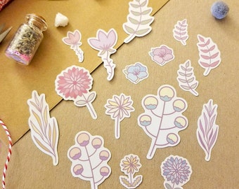 May include: A sheet of pastel-colored floral stickers featuring various flower and leaf designs. The stickers are on a brown paper background.