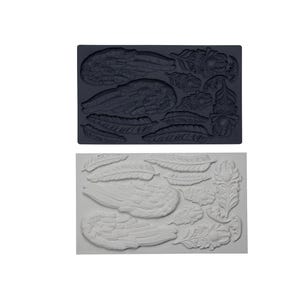 May include: A rectangular silicone mold in dark gray featuring recessed cavities shaped like two large feathered wings, several individual feathers of varying sizes, and a decorative floral element with a central circular detail.