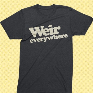 May include: A dark grey t-shirt with the text "Weir everywhere" printed in white.