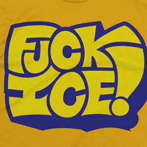 May include: Mustard yellow t-shirt with a blue and yellow graphic that reads "F*CK ICE!" in a bold, stylized font. The text is outlined in blue, creating a striking contrast against the yellow background. The shirt is made of a soft material.