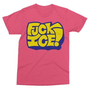 May include: Pink t-shirt with a yellow and blue graphic that reads "FCK ICE!" in a bold, stylized font. The design features a yellow exclamation point. The shirt is made of a soft material.