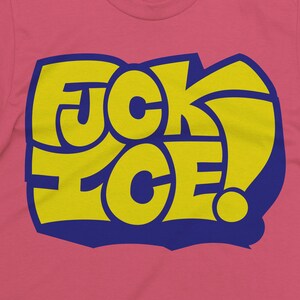 May include: Pink t-shirt with a yellow and blue graphic that reads "FUCK ICE!" in a bold, stylized font. The text is outlined in blue and set against a pink background.