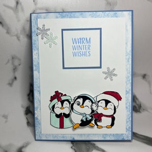 Tarjeta de pingüino de deseos cálidos de invierno