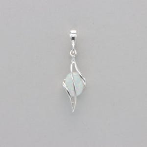 May include: A silver pendant with a white opal stone set in a delicate, swirling design.