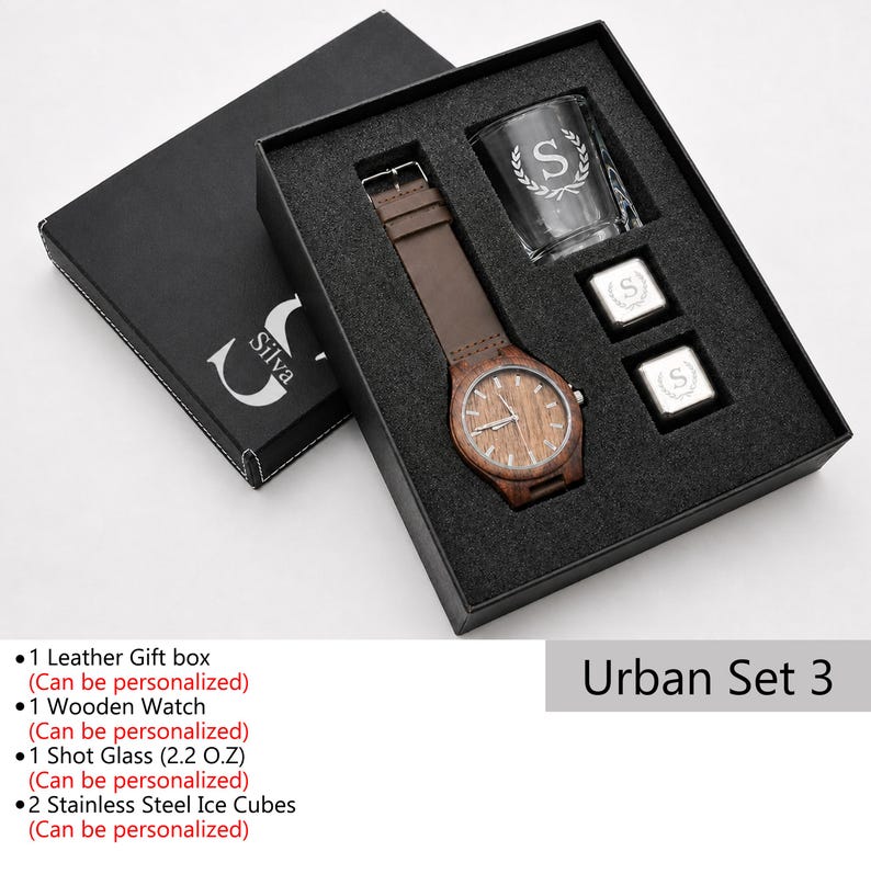 May include: A wooden watch with a brown leather band, a shot glass, and two stainless steel ice cubes, presented in a black gift box. The watch face and glass are engraved with the letter "S". The gift set is labeled "Urban Set 3".