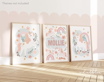 May include: Three framed prints with a pastel colour scheme featuring a unicorn, flowers, and rainbows. The middle print has the name "Mollie" written on it.