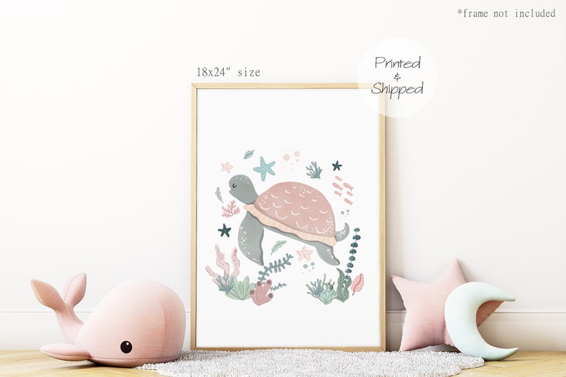 May include: A framed print of a pink and green turtle swimming in a circle of coral, seaweed, and starfish. The print is 18x24 inches and is printed and shipped.