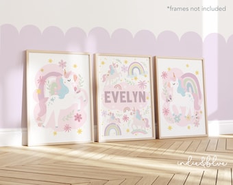 May include: Three pink and white unicorn themed prints with the name "EVELYN" on the middle print.
