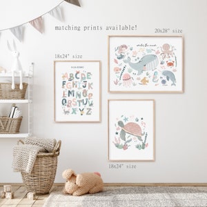 May include: Three framed prints with a nautical theme. The top print is 20x28 inches and features a whale, octopus, and other sea creatures with the text "Under the Sea". The two prints below are 18x24 inches and feature an alphabet chart and a turtle swimming in the ocean.