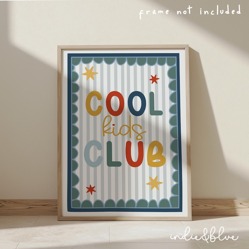 May include: A framed print with the words "COOL kids CLUB" in colorful letters. The background has vertical stripes and star and scalloped border details. The frame is a light wood color.