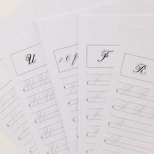 May include: Four sheets of paper with lined practice areas for cursive handwriting. Each sheet features a different letter of the alphabet: I, U, F, and R. The letter is written in cursive at the top of each sheet, with instructions for writing the letter below.