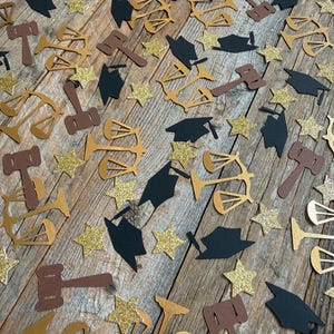 May include: A set of three ceramic canisters with lids, featuring a blue and white floral pattern. The canisters vary in size, with the largest measuring approximately 8 inches in height. They are arranged on a white surface.