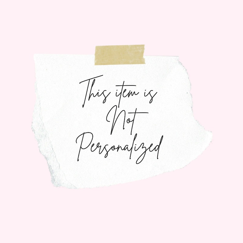 May include: A torn piece of white paper with the text "This item is Not Personalized" in black script, taped to a light pink background with a piece of tan tape.
